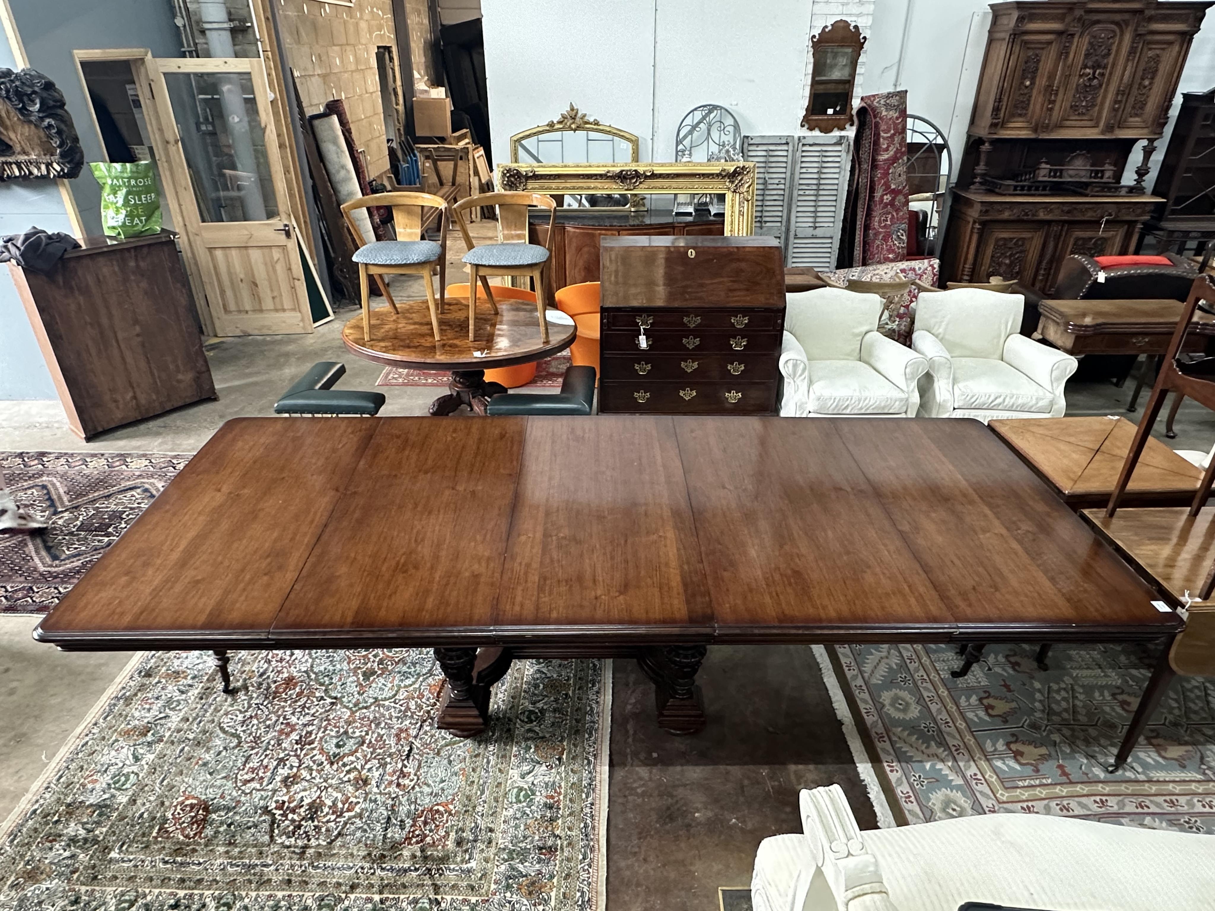 A reproduction French mahogany extending dining table, length 304cm extended, depth 128cm, height 74cm. Condition - good